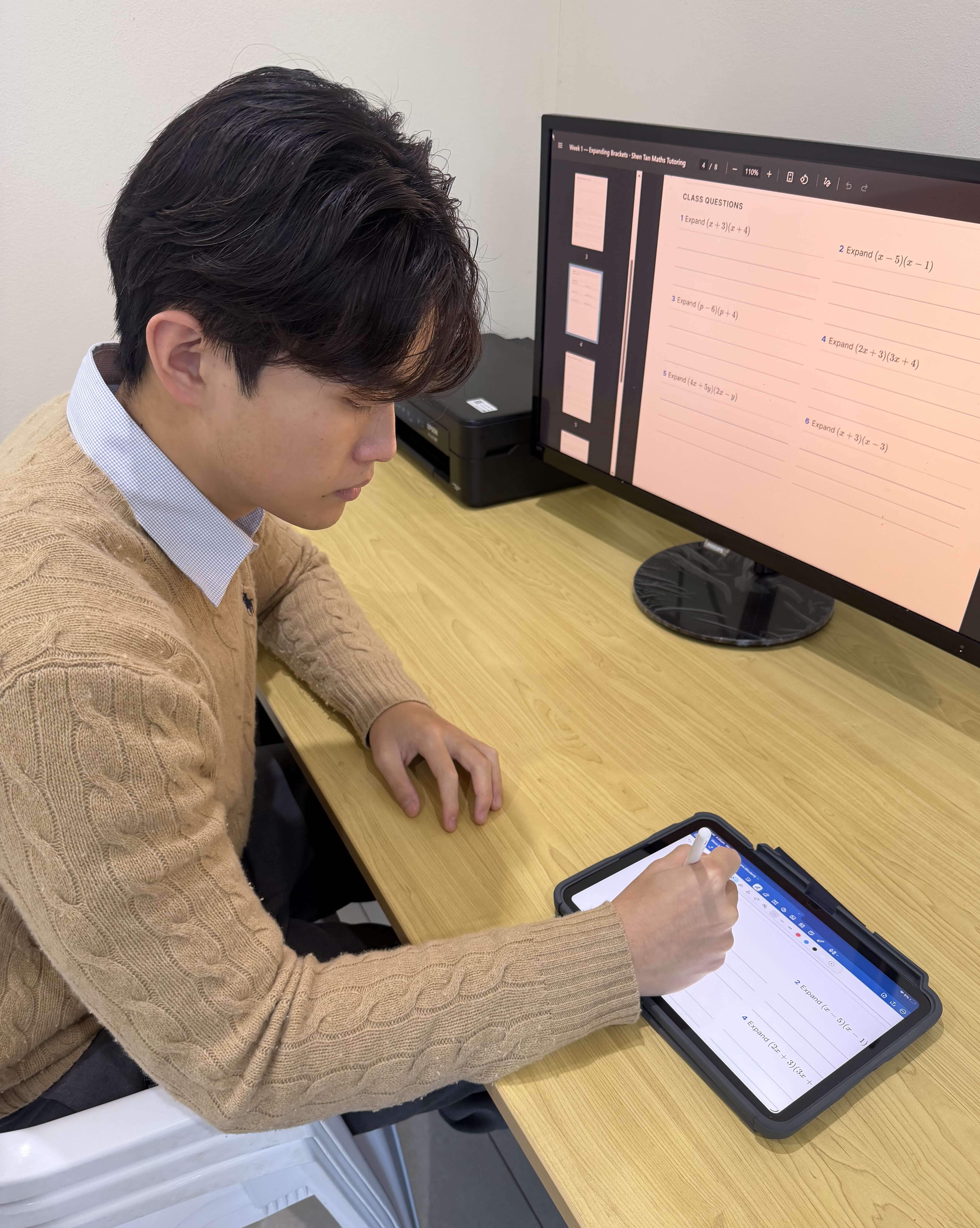 Shen Tan teaching maths to a student in Hurstville